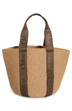 Chloé's classic logo stands out at the sturdy canvas straps of a roomy tote woven from straw for a beachy-keen aesthetic. Open top Top carry handles Unlined Textile Made in Spain Designer Handbags This brand has B Corp certification, representing business practices with emphasis on social and environmental performance, accountability and transparency This brand meets Nordstrom Responsible Brands criteria: brand adheres to responsible social and environmental practices Large Shopper Bag, Raffia Basket, Chloe Logo, Louis Vuitton Logo, Large Basket, Chloe Handbags, Basket Tote, Straw Basket, Embroidered Canvas