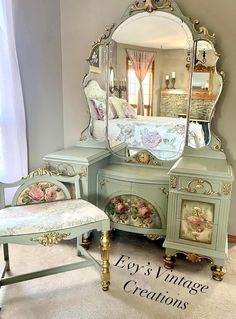 an antique vanity with mirror and stool in a room