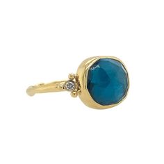 This ring features a gorgeous London Blue Topaz accented with brilliant white diamonds, atop a seagrass band. Set in 14k yellow gold, this ring is perfect for those seeking something unique and beautiful. Approx stone size: 11mm x 9mm Approx TCW: 5.8 cts Mohs hardness scale: 8 This one of a kind piece is handmade with love in Emily's Hudson Valley studio and ready to size and ship. If you have questions about sizing, shipping or need help deciding please reach out to us! Fine Jewelry Blue Topaz Rings With Single Cut Diamonds, 14k Gold Blue Rings With Single Cut Diamonds, Yellow Gold Rings With Diamond Accents And Blue Topaz, Yellow Gold Rings With Blue Topaz And Diamond Accents, 14k Yellow Gold Topaz Ring With Diamond Accents, 14k Yellow Gold Topaz Ring With Gemstone Accents, 14k Yellow Gold Diamond Ring With Gemstone Accents, Yellow Gold Topaz Ring With Diamond Bezel Setting, Hardness Scale