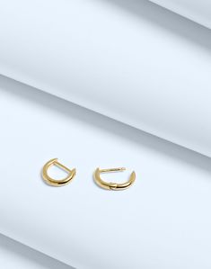 Crafted from 14k gold over sterling silver, our Demi-Fine pieces are future keepsakes meant to be layered and worn every single day (think of them as your jewelry BFFs). These mini huggie hoop earrings are perfect for wearing with anything and everything.Please note: If the closure doesn't clasp properly, carefully bend the post back into place. The function can be recovered if the post is slightly bent up a bit.34 mm x 34 mm.100% recycled sterling silver.Do Well: made using recycled factory scr Gold Sterling Silver Huggie Earrings, Everyday Gold Tarnish-resistant Cartilage Earrings, Gold Huggie Cartilage Earrings In Fine Jewelry Style, Gold Small Hoop Cartilage Earrings Tarnish Resistant, Gold Tarnish Resistant Huggie Cartilage Earrings, Everyday Gold Pierced Huggie Earrings, Tarnish Resistant 14k Gold Filled Huggie Earrings For Anniversary, Gold Minimalist Huggie Earrings In Sterling Silver, Minimalist Gold Huggie Earrings