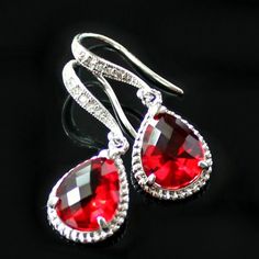 "These beauties are standouts! Perfect for that special occasion! Elegant  jeweled, french earrings carry stunning, red teardrop crystals with a silver rope trim. The crystal detail on these earrings give them such a classy and sophisticated feel. * Sterling Silver-Plated French Earrings * 16K Gold-Plated French Earrings * Swarovski Crystal Detailing * Red Faceted Crystal- 19 x 12mm(3/4x1/2\") including rope trim * Tarnish Resistant * Earring Length- 32mm(1 1/4\") The necklace is available in a separate listing. These earrings come in an organza bag and gift box." French Earrings, Rose Boutique, Crystal Set, Swarovski Crystal Earrings, Wedding Jewelry Earrings, Swarovski Earrings, Wedding Jewelry Sets, Faceted Crystal, Matching Necklaces