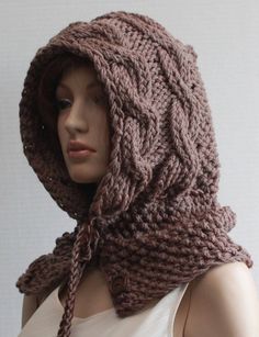 a mannequin wearing a brown knitted hood