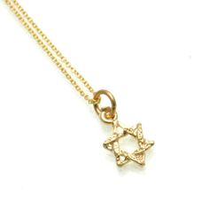 Star of David, Chai and Hamsa petite necklaces in 14k yellow gold. Perfect for layering! Yellow Gold Star Of David Charms Jewelry, Gold Star Of David Charm Necklace With Delicate Chain, Elegant Gold Star Of David Charm Necklace, Dainty Star Of David Charm Necklace With Delicate Chain, Elegant Yellow Gold Star Of David Charm Necklace, Yellow Gold Star Of David Jewelry With Delicate Chain, Gold Star Of David Jewelry For Hanukkah, Gold Star Of David Charm Necklace As Gift, Gold Star Of David Charm Necklace For Gift