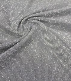 the fabric is shiny silver and has small dots on it