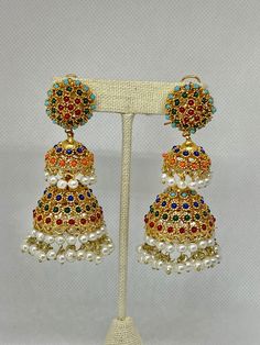 We bring beautiful Jewelry sure to elevate any look! Kindly pay attention to all photos and video and ask questions about the item prior to ordering.  Suggestion  to use Sahara for delicate ears. Multicolor Temple Jewelry Jhumkas For Festivals, Traditional Multicolor Chandbalis With Latkans, Multicolor Temple Jewelry Jhumkas For Celebration, Multicolor Chandbali Jhumkas For Festive Occasions, Festive Multicolor Chandbali Jhumkas, Multicolor Traditional Jhumkas For Celebrations, Multicolor Jhumkas With Latkans For Eid, Traditional Multicolor Jhumkas For Celebrations, Traditional Multicolor Tilla Jhumkas