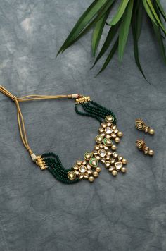 Green Gold Tone Kundan Inspired Necklace.This beautifully handcrafted necklace is a set of silver and copper alloy and plated with 22k gold. Elegant and modern, this kundan necklace will complete your lavish ensemble grandeur. Faux glass polki and shell pearls embellished Gold Plated Kundan Polki Bridal Indian Choker Necklace Set with Earrings highlighted with Green onyx tumble stones. Indian jewellery set, Indian Choker necklace set, Indian bridal jewellery, Indian wedding jewellery. Indian Nec Ceremonial Necklace Set With Earrings For Festivals, Ceremonial Festive Necklace With Matching Earrings, Hand Set Metal Kundan Necklace Gift, Fusion Gold Jewelry Sets For Diwali, Ceremonial Gold Fusion Jewelry Set, Handmade Gold Kundan Choker, Dual-tone Metal Kundan Necklace As Gift, Dual-tone Metal Kundan Necklace For Gift, Silver Kundan Necklace With Gold Beads For Gift