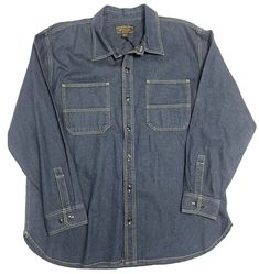 Item: Filson Clarkston Denim Shirt Condition: NEW  Color: Dark Indigo Product #: 20223228 Note: Pristine! Info: As tough as many jeans, Filson’s Clarkston Denim Work Shirt is built to stand up to long days on the toughest jobs, year after year. The 12.5-oz. 100% cotton denim will develop its own wear and patina, telling the stories of jobs done well. The chest pocket bottoms are reinforced with a second layer of denim for durability, and the back features dual shoulder pleats for ease of motion. Button-front and spread collar. Prewashed. FEATURES Built with durable 12.5-oz. denim Spread collar Button-front closure and button-adjustable cuffs Rear shoulder pleats for ease of motion Reinforced chest pockets Prewashed for shrinkage control and comfort Casual Cotton Jeans With Snap Buttons, Medium Wash Cotton Jeans With Snap Buttons, Cotton Jeans With Snap Buttons In Medium Wash, Classic Cotton Jeans With Snap Buttons, Cotton Button-up Dark Wash Jeans, Denim Shirt With Snap Buttons For Work, Denim Blue Cotton Top With Snap Buttons, Classic Denim Blue Denim Shirt, Classic Denim Blue Shirt