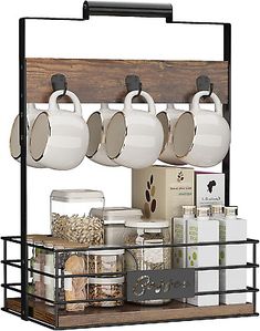 the coffee pot rack is holding cups and mugs