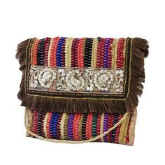 a multicolored bag with fringes and beads on the front, sitting against a white background