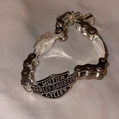 a motorcycle chain bracelet with the words harley davidson on it