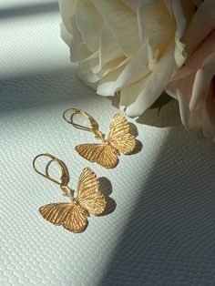 Please Read   Photos are enlarged to show detail. Please read the measurement in the description.  ☑️ The lever back ear wires are 14kt gold filled. ☑️ The charms are Bronze and measure approximately 21x24mm. ❤️ Follow us on Instagram for new designs and discount codes. @mathewandmarieco Delicate Gold Tarnish-resistant Earrings, Adjustable Pierced Yellow Gold Earrings, Adjustable Tarnish-resistant Wedding Earrings, Gold Delicate Tarnish-resistant Earrings, Adjustable Yellow Gold Earrings, Adjustable Hypoallergenic Gold Earrings, Adjustable Butterfly Shaped Yellow Gold Jewelry, Elegant Butterfly Earrings For Everyday Wear, Elegant Butterfly Earrings For Everyday