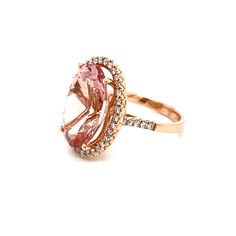 This is a magnificent natural morganite and diamond halo ring set in solid 14K rose gold. The natural and large 18X13MM Morganite oval has an excellent peachy pink color (AAA quality gem) and is set on top of a gorgeous diamond encrusted shank. The ring is stamped 14K and is a true showstopper. This is one of Amy's personal favorite designs! Details: ►Metal: Rose Gold ►Gold Purity 14K ►Natural Gemstone: Morganite (Part of the Beryl Family) ►Gemstone Weight: 11.06 carat ►Gemstone Color: Peachy Pi Luxury Pink Oval Halo Ring, Oval Morganite Ring In Pink Gold, Oval Morganite Rings In Pink Gold, Pink Gold Morganite Oval Ring, Oval Pink Morganite Diamond Ring, Oval Pink Gold Diamond Ring, Oval Pink Gold Diamond Ring For Formal Occasions, Formal Oval Pink Gold Diamond Ring, Halo Ring Set