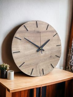 a wooden clock sitting on top of a table