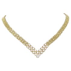 Immerse yourself in the elegance of this sophisticated 14k gold necklace, adorned with a total of 3 carats of dazzling diamonds, primarily in the G-H color range and VS clarity. With a length of 17.25 inches and a width of 8mm, this necklace is a perfect blend of grace and luxury. Marked with "14k PAT. 3308517" and weighing 37.7 grams, it exudes both timeless charm and meticulous craftsmanship. Elevate any occasion with the radiant beauty of this exquisite diamond necklace. Luxury Exquisite Yellow Gold Diamond Necklace, Chopard Necklace, Exquisite Diamond Necklace, Radiant Beauty, 3 Carat Diamond, Diamond Choker, Yellow Gold Necklace, Family Jewellery, Gold Choker Necklace