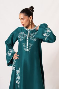 A long teal rawsilk shirt features delicate embroidery in a contrasting ivory colour. Paired with matching trousers. Model Height is 5'6 and Shirt length is 50" Sania Maskatiya, Ivory Colour, Delicate Embroidery, Website Features, Silk Trousers, Pakistani Dress Design, How To Dye Fabric, Ivory Color, Raw Silk