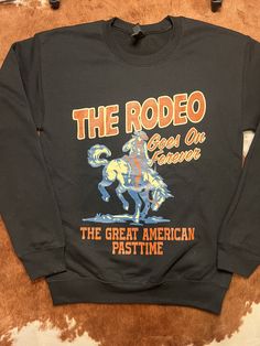 The Rodeo Goes on forever crewneck. The perfect crewneck for cold rodeo nights. Super soft Gildan crewneck from size small-XL Parker Mccollum Concert Outfit, Western Outfits Women Country, Parker Mccollum Concert, Rodeo Outfits Winter, Megan Moroney Concert, Outfit Ideas Nashville, Winter Western Outfits, Womens Western Outfits, Zach Bryan Concert Outfit