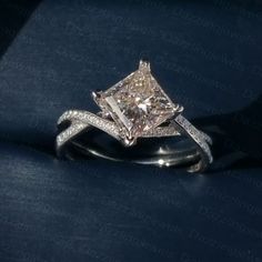 an engagement ring with a princess cut diamond