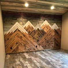 an empty room with wood paneling on the walls