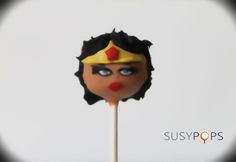 a close up of a lollipop with a face on it's stick