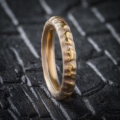 * Price may vary depending on ring size, please inquire with us directly with your needed size for accurate pricing! This Mokume Gane ring is patterned in Arn's signature Guri Bori pattern, which leaves the carved surface as relief showing the layers like topographic lines which match the contours of the carving. Reminiscent of a bird's eye view of a mountain landscape, this ring brings the timeless beauty of nature to a beautiful ring you can treasure. This Guri Bori Mokume Gane ring is shown i Mokume Gane Ring, Bird's Eye View, Mokume Gane, Birds Eye View, Beautiful Ring, Mountain Landscape, Red Gold, Precious Metals, Timeless Beauty