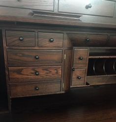 a large wooden dresser sitting on top of a hard wood floor