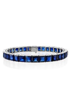 Princess-cut sapphires lend striking cerulean beauty to this polished platinum tennis bracelet from the label's sculptural, statement-making Icon Collection. 7" length Tongue-and-groove closure Total sapphire weight: 16.50ct. Platinum/sapphire Made in the USA Luxury Sapphire Bracelet, Luxury Sapphire Gemstone Tennis Bracelet, Luxury Sapphire Diamond Bracelet With Gemstones, Luxury Sapphire And Diamond Bracelet, Luxury White Gold Sapphire Diamond Bracelet, Luxury Sapphire Tennis Bracelet, Luxury Blue Diamond Bracelet, Luxury Sapphire Diamond Bracelet For Formal Events, Luxury Sapphire Diamond Bracelet For Formal Occasions