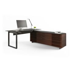 an office desk with a computer on top of it and a drawer underneath the desk