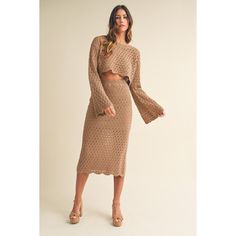 This long bell sleeve knit crochet skirt set is the perfect addition to your wardrobe. The scallop hem crop top and matching midi skirt with a side slit exude elegance and style. Made with a soft blend of acrylic and rayon, this set is comfortable and versatile. Perfect for any occasion! Matching Skirt And Top Set Crochet, Winter Sets Outfits, Crochet Baby Skirt, Matching Skirt And Top Set, Crochet Skirt Set, Knit Skirt Pattern, Sweater Skirt Set, Crochet Midi, Baby Skirt