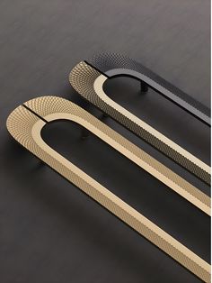 three different types of handles on a black surface