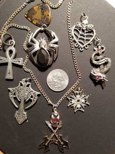 LOT - Skulls, snake, spider, blades, guitar, pick and crosses, a collection of good looking pieces for the rock heart, black enamel and red stone details, with one chain, switch out the pendants or add chains and sell individually. 7 Pendant/charms, 1 pick and 1 chain = 9 Items Punk Style Jewelry For Halloween Concert, Gothic Jewelry For Halloween Concert, Gothic Halloween Jewelry For Concert, Rock Style Jewelry For Halloween And Alternative Fashion, Silver Jewelry For Halloween Concert, Silver Halloween Concert Jewelry, Alternative Halloween Jewelry For Concert, Alternative Style Jewelry For Halloween Concert, Rock Style Jewelry For Halloween Concert