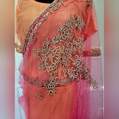 New Indian Pakistani Stitched Net Saree With Stone Work Super Stunning It's A Double Shade Saree, Features Orange And Pink Shades Net Saree With Stone Work. Never Even Tried On. Bust 21.5 Inches Fits Medium To Large All Clothing Items Are Final Sale. Please Ask Questions If You Have Any. Designer Pink Pre-draped Saree With Cutdana, Designer Pink Pre-draped Saree With Zari Work, Pink Cutdana Pre-draped Saree For Party, Elegant Pink Blouse Piece With Traditional Drape, Festive Pink Pre-draped Saree With Sheer Dupatta, Elegant Pink Festive Blouse Piece, Fitted Peach Saree For Festivals, Elegant Pink Pre-draped Saree For Festivals, Pink Sharara With Dori Work