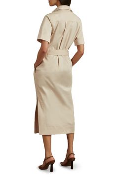 A drapey D-ring belt defines the waist of this polished shirtdress designed in a longline silhouette with abbreviated sleeves. Hidden-button half placket Spread collar Short sleeves Chest flap pockets; side-seam welt pockets Removable D-ring belt 74% cotton, 23% lyocell, 3% elastane Machine wash, line dry Imported Formal Button-up Midi Dress With Tie Waist, Elegant Collared Shirt Dress With Placket, Elegant Collared Midi Dress With Placket, Chic Short Sleeve Belted Dress For Office, Short Sleeve Midi Dress With Placket For Workwear, Chic Shirt Dress With Placket For Work, Formal Collared Midi Dress With Placket, Formal Knee-length Midi Dress With Placket, Chic Collared Shirt Dress For Work