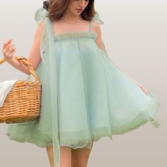 Turn heads in this Y2K Mesh Puffy Dress! 💃✨ Perfect for any occasion. Shop now! #FashionGoals #DressToImpress #kawaiifashionco Balletcore Style Summer Party Dresses, Green Fairy Dress For Spring, Spring Mini Dress With Tulle And Spaghetti Straps, Summer Balletcore Fairy Dress, Green Sleeveless Prom Dress For Summer, Spring Prom Fairy Dress With Ruffles, Spring Lace Fairy Dress, Green Sleeveless Tutu Dress For Party, Sleeveless Green Tutu Dress For Party