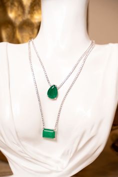 Our Oval Green Tennis Choker necklace exudes a vintage-inspired glamor that is timeless yet contemporary, making it the perfect complement to your wardrobe and next special occasion. A classic chain and luscious green solitaire stone become the main focal point, all crafted with 925 sterling silver. Metal Type: 925 Sterling Silver Length: 13"+2" Elegant Green Oval Necklace, Elegant Oval Pendant Gemstone Drop Necklace, Silver Emerald Pendant Necklace With Clavicle Chain, Fine Jewelry Green Necklace With Stones, Green Sterling Silver Necklace With Jewels, Silver Teardrop Pendant Emerald Necklace, Silver Emerald Pendant Necklace, Silver Teardrop Pendant Emerald Necklace For Formal Occasions, Elegant Oval Sterling Silver Chain Necklace