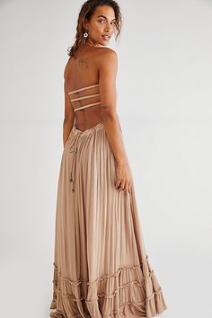 Crinkly strapless maxi dress, made from our sheer and gauzy free-est fabric, with a stretchy smocked bodice, halter neck tie, and low strappy back. Raw seam detailing on the hem. Throw on top of a bikini or layer over one of our seamless styles for an effortless look. | Extratropical Maxi Dress by free-est at Free People in Tan, Size: L Western Blouses, Senior Pictures Dresses, Outfits For Spain, Engagement Photo Dress, Blouses Designs, Floral Dress Design, Collection Ideas, Strapless Maxi, Flowy Maxi Dress