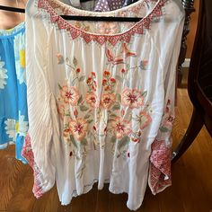 Embroidered Tunic Floral Embroidered Long Sleeve Top For Vacation, Long Sleeve Floral Embroidered Top For Vacation, Spring Long Sleeve Top With Geometric Embroidery, Multicolor Embroidered Long Sleeve Top For Vacation, Spring Vacation Blouse With Intricate Embroidery, Bohemian Spring Embroidered Top With Intricate Details, Long Sleeve Embroidered Top With Geometric Design For Spring, Long Sleeve Embroidered Top For Vacation, Intricate Embroidery Blouse For Spring Vacation