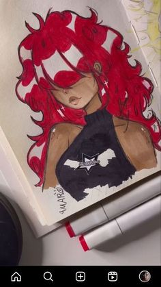 a drawing of a woman with red hair on top of a white surface next to a pen