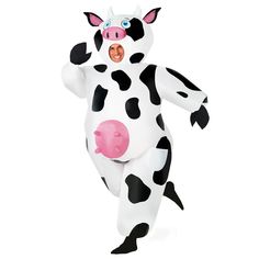 a man in a cow costume is standing on one leg and has his mouth open