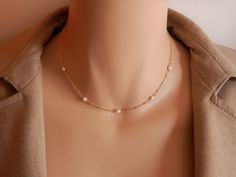 dainty gold choker dainty pearl choker gold rosary choker gold chain choker necklace gold satellite chain gold satellite necklace A beautiful pearl necklace on a satellite chain. Five freshwater pearls and a satellite chain make this necklace of a beautiful and elegant jewel! It can be made on a sterling silver or gold vermeil chain. Please, message me if you want a specific length that is not shown in the menu or if you are not sure of the length. Pearls may have imperfections as they are natur Dainty Pearl Charm Choker Jewelry, Minimalist Pearl Pendant Choker, Delicate Pearl Charm Choker Jewelry, Delicate Choker With Delicate Chain, Dainty Pearl Choker Necklace With Adjustable Chain, Dainty Pearl Choker Jewelry, Minimalist Pearl Choker Jewelry, Gift Pearl Necklace With Satellite Chain, Dainty Pearl Pendant Choker