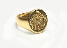 Antique Yellow Gold Crest Men's Ring Classic Ceremonial Signet Ring With Polished Finish, Classic Engraved Ceremonial Signet Ring, Classic Engraved Signet Ring For Ceremonial Occasions, Classic Engraved Signet Ring For Ceremonial Use, Classic Oval Ceremonial Signet Ring, Classic 14k Gold Signet Ring For Ceremonial Occasions, Classic Formal Rings With Coat Of Arms, Antique Signet Ring With Maker's Mark For Formal Occasion, Formal Yellow Gold Engraved Ring With Coat Of Arms