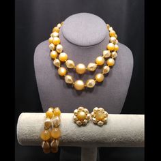 *Description: This is a beautiful jewelry set of Champaign beige Moonglow Lucite beads from the 1950s.  The necklace is two strands of graduated Moonglow beads and pearled beads, also in beige.  The matching memory wire bracelet is 7 1/2 Inches and fits easily around your arm.  The earrings are clips and are 1 1/8 inches in length and width.  The entire set looks lovely and would be a great addition to your vintage jewelry collection or make a great vintage gift! *Approximate Measurements: Neckl Moonglow Necklace, Bracelet Clip, Lucite Jewelry, Memory Wire Bracelet, Memory Wire Bracelets, Bracelet Women, Plastic Jewelry, Set Necklace, Moon Glow