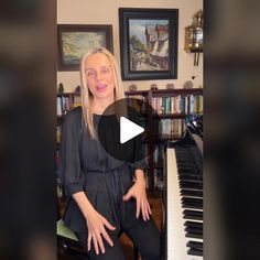 a woman sitting in front of a piano