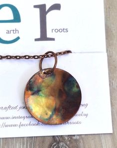 This boho style minimalist necklace features a pendant designed from a copper disc 1" in diameter that has been shaped and fire painted with a propane torch to bring out the different colors in the metal when heated. NOTE:  Certain lighting will bring the colors out more than other types of lighting. It comes with a 16" copper chain and will ship in a gift box with USPS tracking info  provided. Propane Torch, Fire Painting, Jewelry Minimalist, Minimal Jewelry, Disc Pendant, Copper Necklace, Copper Chain, Pendant Design, Style Minimalist