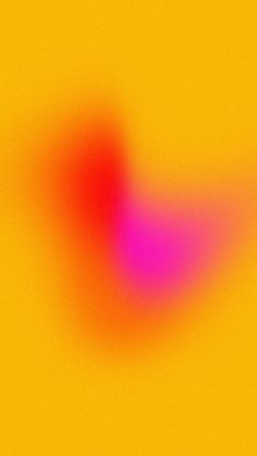 a blurry image of an orange and pink object