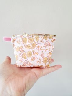 "100% Cotton. Lightweight. From the world famous Liberty Fabrics with a silk-like touch, unique print quality and striking color vibrancy. This mini pouch is great size for a couple of small items. Size is 4.25\"W / 3\"H / 1.5\"D (10.5cm / 7cm / 4cm) Flat bottom shape. Fabric is Liberty of London Tana Lawn / Exclusive print. Imported from UK. The pouch opens with golden color zipper.(High quality YKK zipper) It comes with a velvet ribbon on one side.(color is pale pink) Lined inside with pretty Mini Zipper Pouch, Liberty Fabrics, Pouch Makeup, Fabric Pouch, Baby Pink Colour, Mini Pouch, Mini Pouches, Pretty Prints, Ykk Zipper