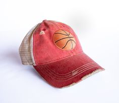 a red hat with a basketball embroidered on it