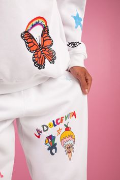 This is a Pre-Order, item will ship by 11/25 Mayfair x ISCREAMCOLOUR collaboration White doodle sweatpants 100% Cotton Image 1: Model is 5'8" and wearing size S/M Turn inside out and machine wash cold with like colors Athleisure Graphic Print Loungewear Pants, Athleisure Graphic Print Pants For Loungewear, Athleisure Graphic Print Lounge Pants, White Graphic Print Athleisure Bottoms, Playful Cotton Joggers For Loungewear, Playful Relaxed Fit Sweatpants For Loungewear, Playful Cotton Streetwear Bottoms, Playful Cotton Bottoms For Streetwear, White Sporty Sweatpants With Graphic Print