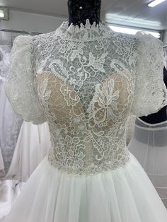 the back of a wedding dress on display at a bridal shop in london, england