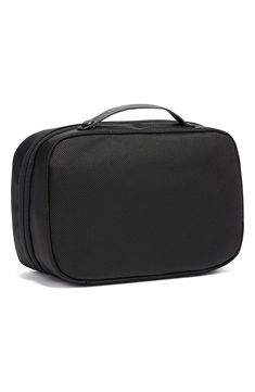 Featuring interior organization pockets and an antibacterial lining, this compact travel kit is shaped from tough FXT ballistic nylon for long-wearing durability. This travel essential is part of the Tumi Tracer program that helps locate missing or stolen bags. Style Name:Tumi Alpha 3 Split Travel Kit. Style Number: 5716494. Packable Black Travel Accessories, Functional Black Portable Travel Bag, Black Packable Travel Accessories For On-the-go, Functional Portable Travel Bag For Storage, Packable Versatile Black Travel Accessories, Functional Nylon Portable Travel Bag, Practical Black Packable Travel Bag, Practical Portable Cases For Storage, Versatile Packable Black Travel Accessories