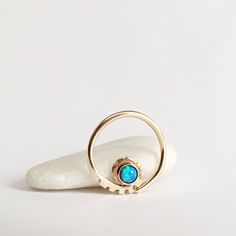 Lovely opal piercing hoop. Use it as a septum ring or as a daith earring. Super comfortable, perfect for long daily use. Metal: 14K yellow solid gold. The hoop is stamped with 14K solid gold mark. There are 6 opal colors of your choice, see variations in drop-down menu. Made to order. Will arrive in a pretty gift box ready to give or keep. All of our jewelry is created in our home studio in Rehovot, Israel. If You like our handwork please pin it on Pinterest, click Like or Tweet for your friends Opal Piercing, Daith Hoop, Daith Earring, Daith Jewelry, Daith Piercing Jewelry, Daith Earrings, Ring Opal, Septum Jewelry, Daith Piercing